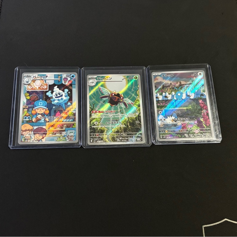 Three Japanese, Pokémon cards.